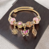 Bracelet charms doré papillon rose Acier