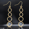 Boucles d'oreilles dorée anneaux et perle métallique