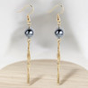 Boucles d'oreilles pendantes dorées et perle métallique Plaqué or