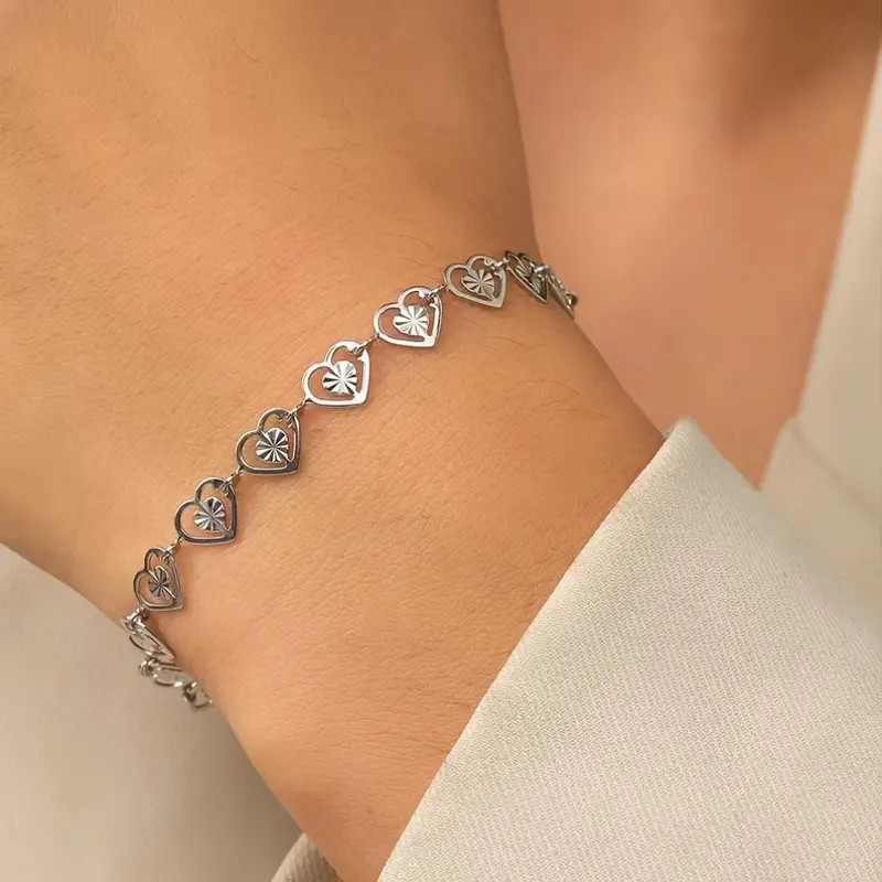Bracelet argenté coeurs ajourés Acier