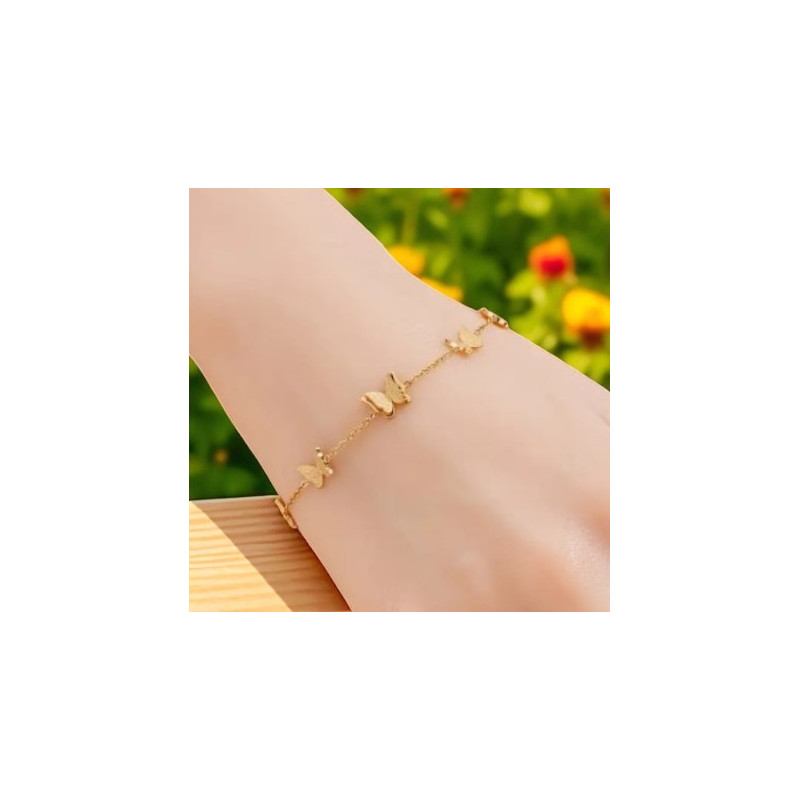 Bracelet doré papillons en relief Acier