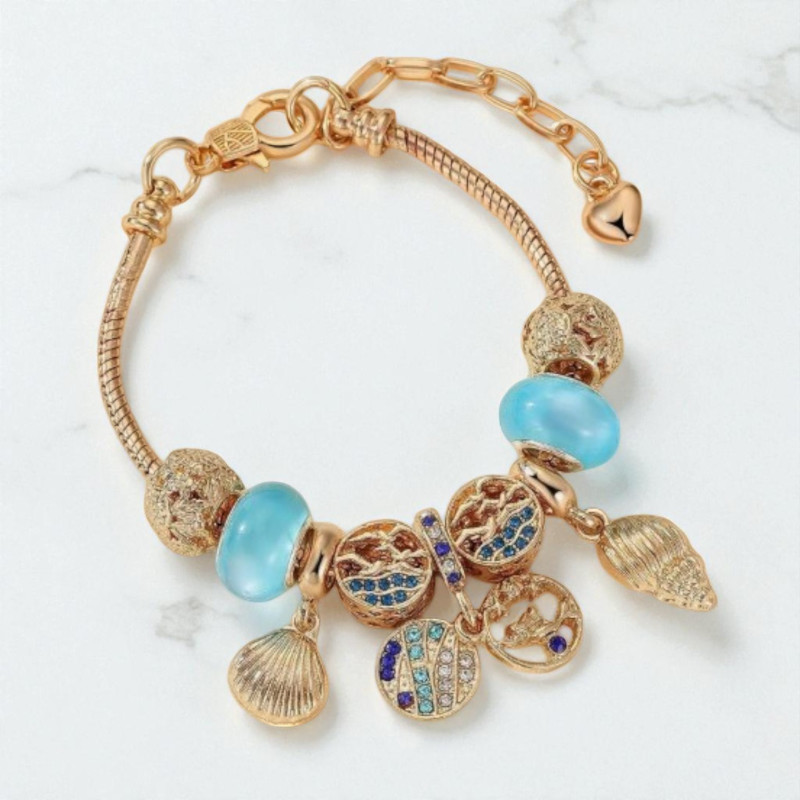 Bracelet charms doré coquillages et perles bleues