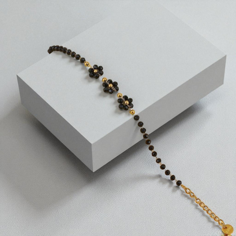 Bracelet doré fleurs et perles noires Acier