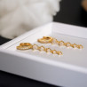 Boucles d'oreilles pendantes dorées avec strass Plaqué or