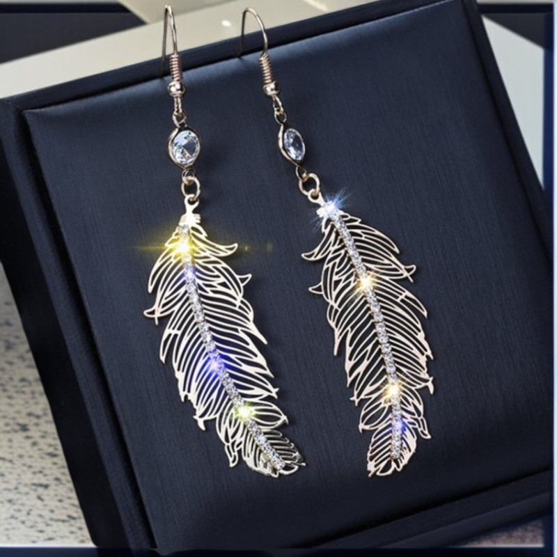 Boucles d'oreilles argentées plumes avec strass