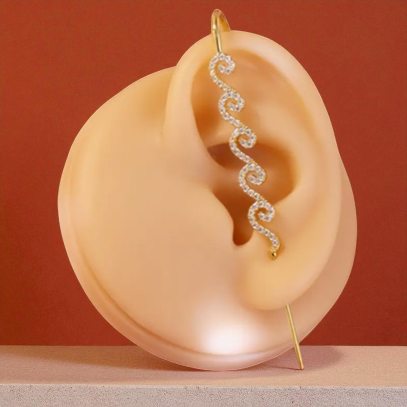 Boucle d'oreille traversante spirales dorées avec strass