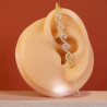 Boucle d'oreille traversante spirales dorées avec strass