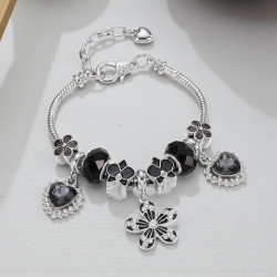 Bracelet charms fleur et cœurs noirs
