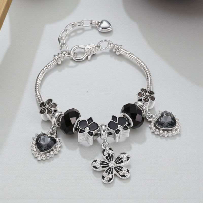 Bracelet charms fleur et cœurs noirs