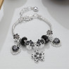 Bracelet charms fleur et cœurs noirs
