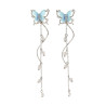 Boucles d'oreilles torsadées argentées papillon bleu