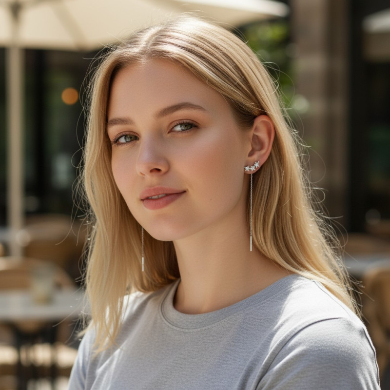 Boucles d'oreilles pendantes argentées étoiles et strass