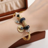 Bracelet charms doré mauvais œil et perles noires Acier