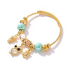 Bracelet charms doré hibou et perles bleues Acier