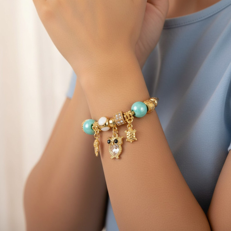 Bracelet charms doré hibou et perles bleues Acier