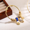 Bracelet charms doré main de fatma et perle bleue Acier