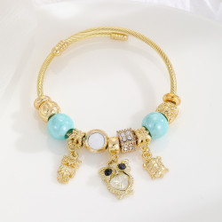 Bracelet charms doré hibou et perles bleues Acier