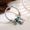 Bracelet charms argenté papillon multicolore et perles vertes Acier