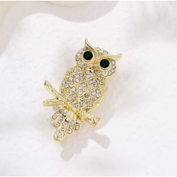 Broche dorée hibou strass blanc