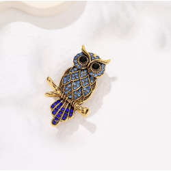 Broche dorée hibou strass bleus