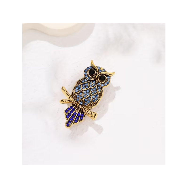 Broche dorée hibou strass bleus