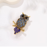 Broche dorée hibou strass bleus