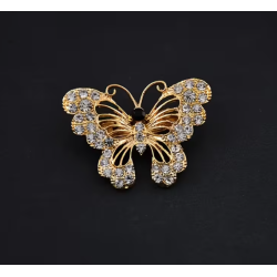 Broche dorée papillon ajouré avec strass