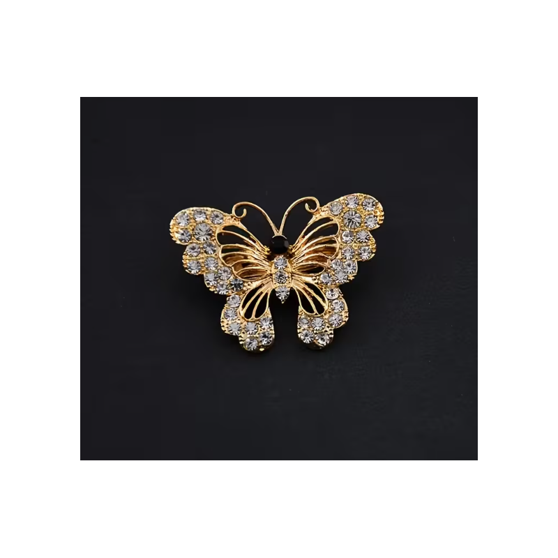 Broche dorée papillon ajouré avec strass