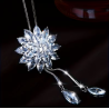 Collier argenté sautoir flocon blanc