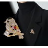 Broche dorée oiseau strass multicolore