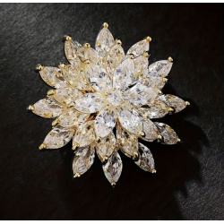 Broche dorée fleur zircon blanc