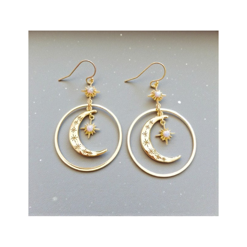 Boucles d'oreilles dorées croissant de lune et étoiles