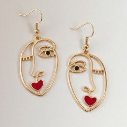 Boucles d'oreilles dorées visage abstrait