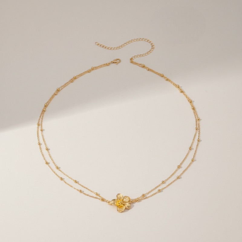 Chaîne de taille fleur et perles dorées