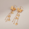 Boucles d'oreilles dorées pendantes papillons filigranés