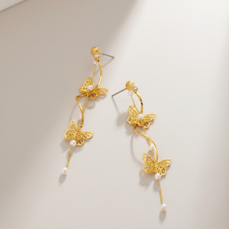 Boucles d'oreilles torsadées dorées papillons et perles
