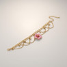 Chaîne de cheville dorée chaînettes et fleur rose