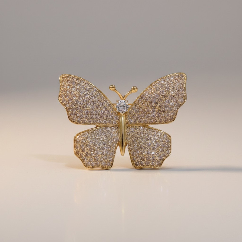 Broche dorée papillon et strass
