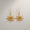 Boucles d'oreilles dorées soleil ambré
