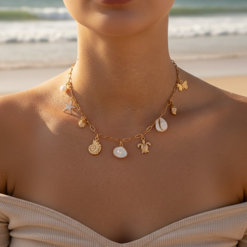 Collier doré charms coquillages et étoile de mer