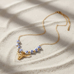 Collier doré buffle et perle bleues Acier