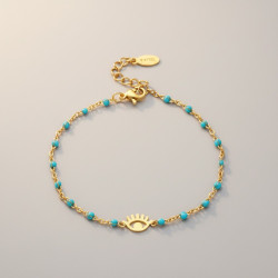 Bracelet doré oeil et perles d'émail bleues ciel Acier