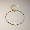 Bracelet doré oeil et perles d'émail noires Acier