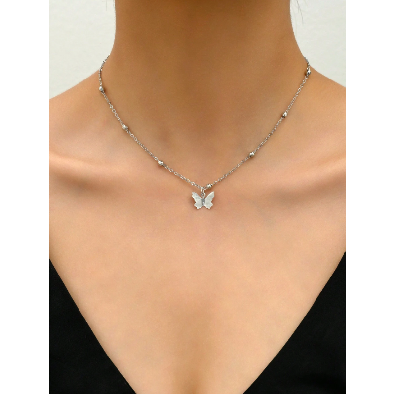 Collier de dos argenté papillons