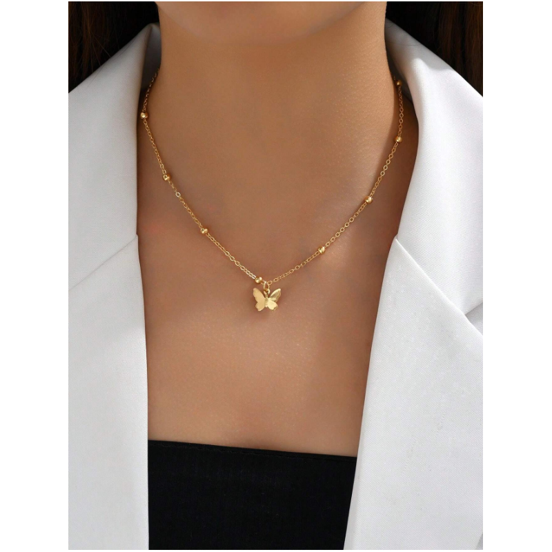 Collier de dos doré papillons