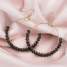 Boucles d'oreilles dorées rondes avec perles noires